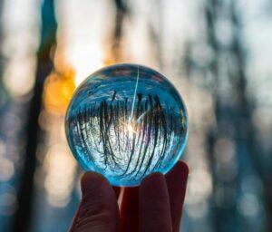 photo of person holding crystal ball