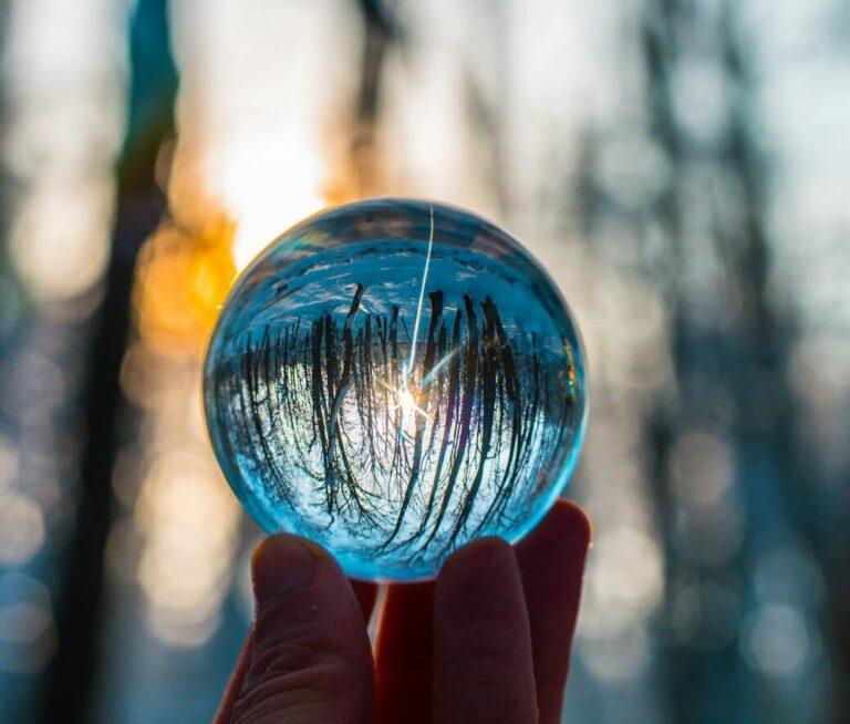 photo of person holding crystal ball