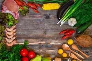 vegetables and tomatoes on cutting board