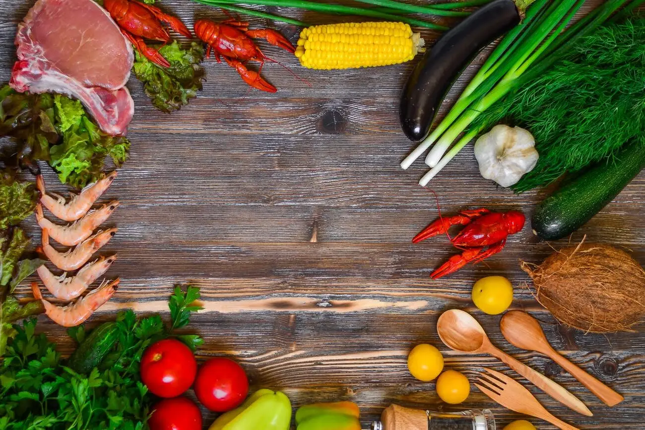 vegetables and tomatoes on cutting board