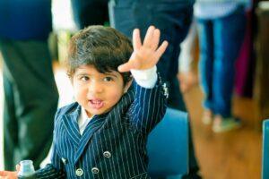 a little boy in a suit