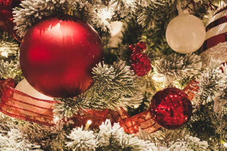 red and white christmas balls hanging oon christmas tree