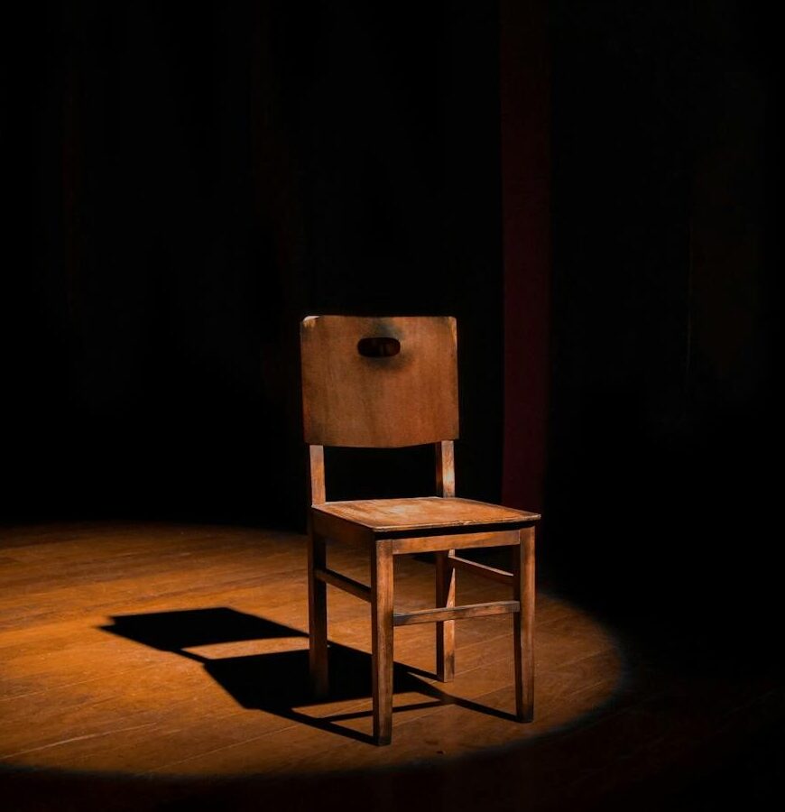 empty brown wooden armless chair